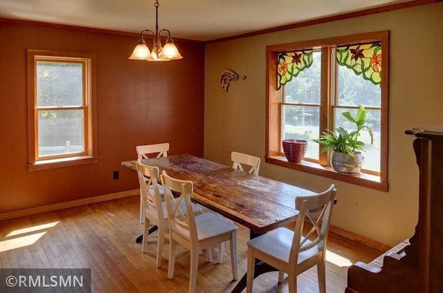 1217 83rd Ave, Lincoln Twp, WI 54001 - dining area with wood-type flooring, healthy amount of natural light, crown molding, and a chandelier