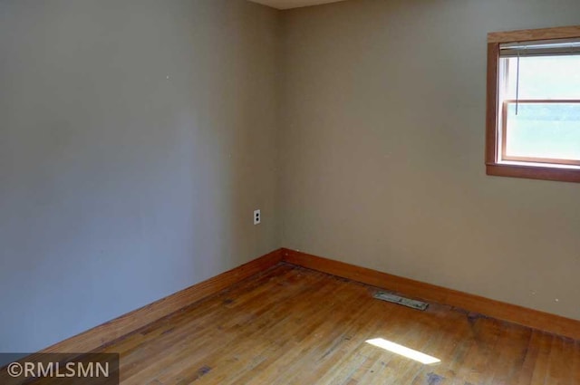 1217 83rd Ave, Lincoln Twp, WI 54001 - spare room featuring baseboards and hardwood / wood-style flooring