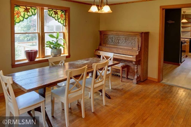 1217 83rd Ave, Lincoln Twp, WI 54001 - dining space with light wood finished floors and crown molding