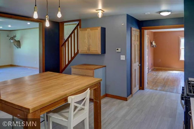 1217 83rd Ave, Lincoln Twp, WI 54001 - dining area featuring stairs and light wood-style floors