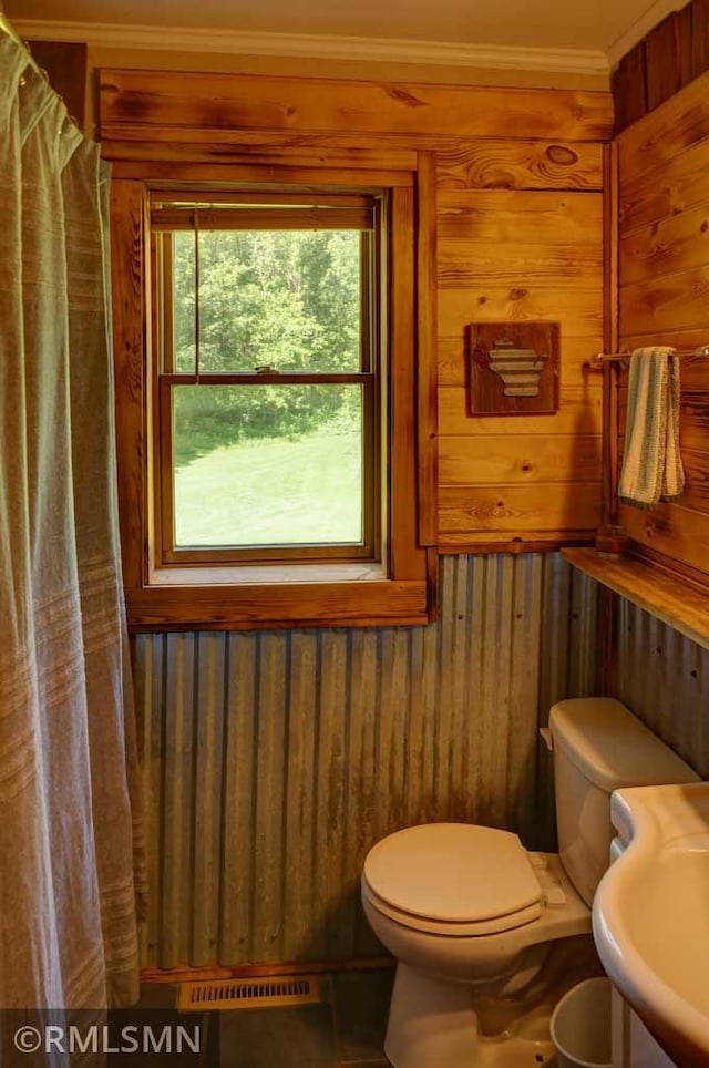 1217 83rd Ave, Lincoln Twp, WI 54001 - bathroom featuring wood walls, crown molding, and a shower with shower curtain