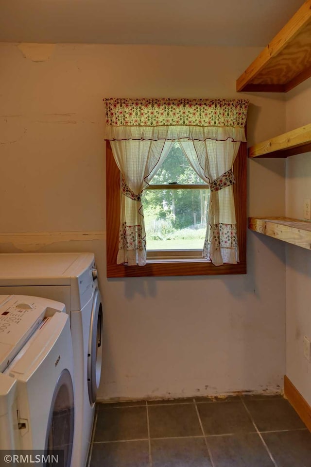 1217 83rd Ave, Lincoln Twp, WI 54001 - laundry room with washer and clothes dryer and dark tile patterned flooring