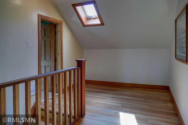 1217 83rd Ave, Lincoln Twp, WI 54001 - bonus room featuring a skylight, lofted ceiling, and wood finished floors