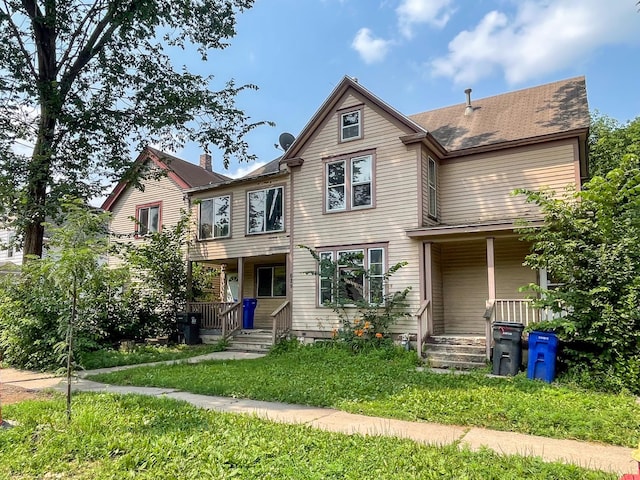 629 Farrington St, Saint Paul, MN 55103 - view of front facade with a porch