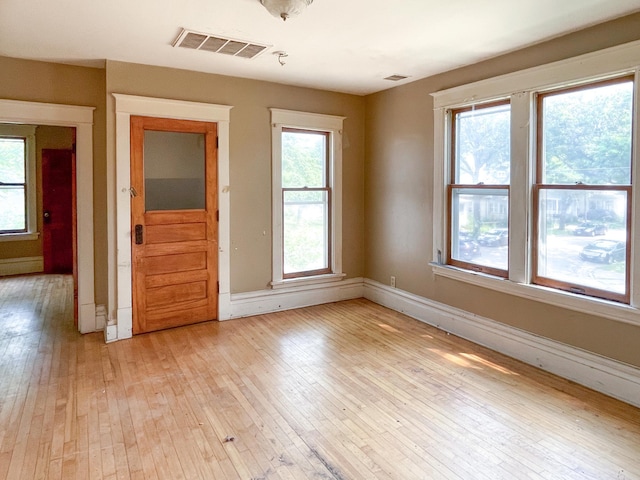 629 Farrington St, Saint Paul, MN 55103 - empty room featuring light wood-style flooring and healthy amount of natural light