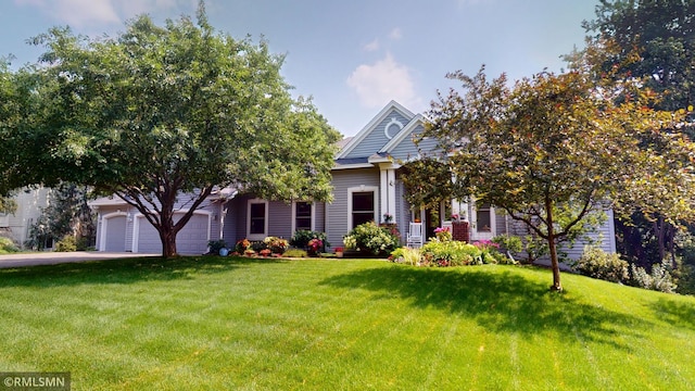 13840 Edenwood Way, Apple Valley, MN 55124 - view of property hidden behind natural elements featuring a front yard, an attached garage, and driveway