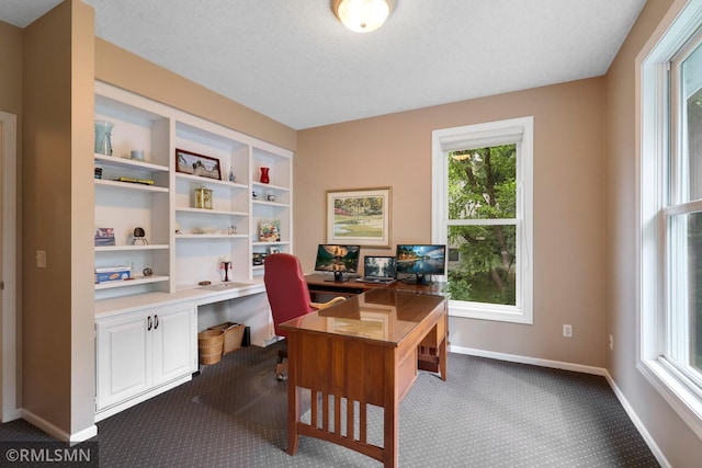 13840 Edenwood Way, Apple Valley, MN 55124 - office area featuring dark carpet and built in desk