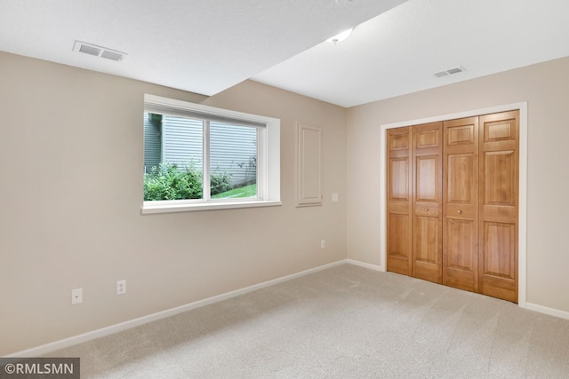 13840 Edenwood Way, Apple Valley, MN 55124 - unfurnished bedroom featuring carpet and a closet