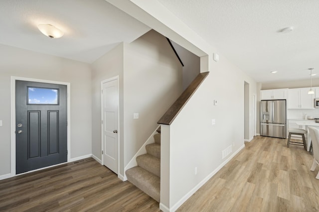 757 Greywood Blvd SW, Delano, MN 55328 - entrance foyer with stairs and light wood-style flooring