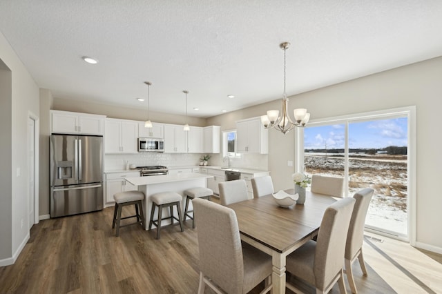 757 Greywood Blvd SW, Delano, MN 55328 - dining area with a chandelier, dark wood-style flooring, and recessed lighting