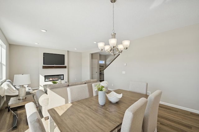 757 Greywood Blvd SW, Delano, MN 55328 - dining area with a chandelier, wood finished floors, recessed lighting, and a glass covered fireplace