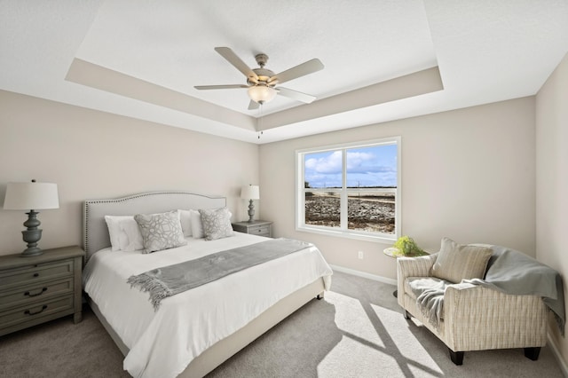 757 Greywood Blvd SW, Delano, MN 55328 - carpeted bedroom featuring a tray ceiling and a ceiling fan