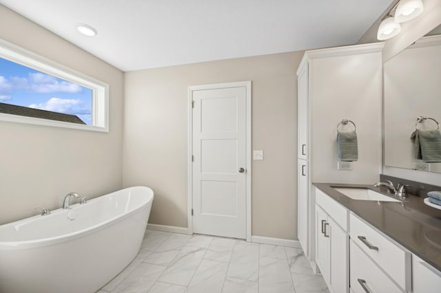757 Greywood Blvd SW, Delano, MN 55328 - bathroom with a soaking tub, marble look tiles, and vanity