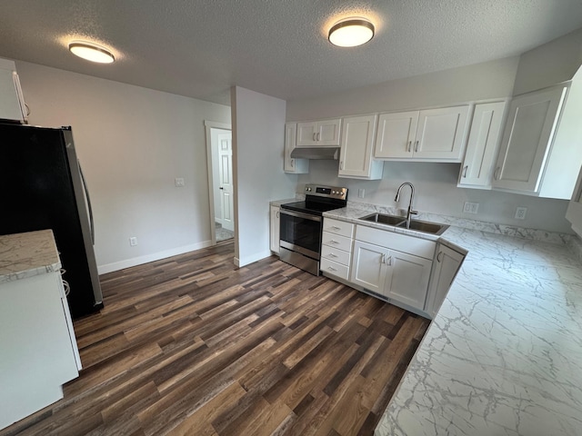406 22nd St S, Fargo, ND 58103 - kitchen featuring stainless steel appliances, under cabinet range hood, a textured ceiling, white cabinets, and light stone counters