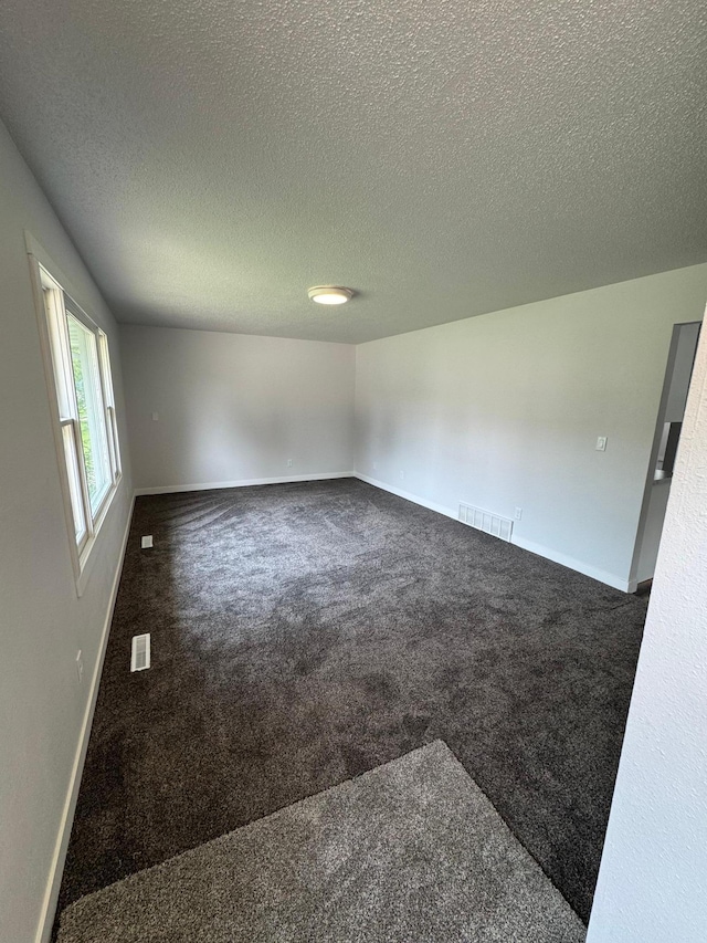 406 22nd St S, Fargo, ND 58103 - spare room featuring carpet and a textured ceiling