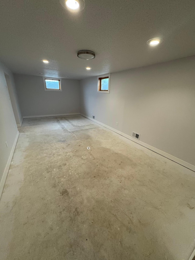 406 22nd St S, Fargo, ND 58103 - below grade area featuring recessed lighting and a textured ceiling