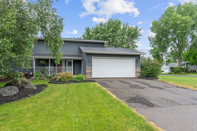 6494 Bonner Ct, Inver Grove Heights, MN 55076 - view of front of home with an attached garage, driveway, a front yard, and covered porch