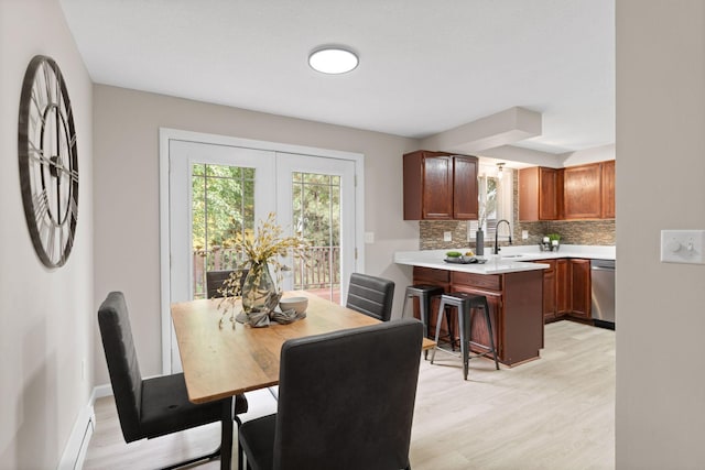 6494 Bonner Ct, Inver Grove Heights, MN 55076 - dining area featuring light wood-style flooring and baseboards