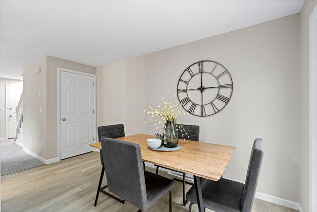 6494 Bonner Ct, Inver Grove Heights, MN 55076 - dining space featuring light wood finished floors and stairs