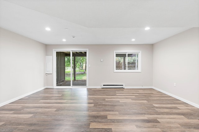 6494 Bonner Ct, Inver Grove Heights, MN 55076 - spare room featuring baseboard heating, recessed lighting, and wood finished floors