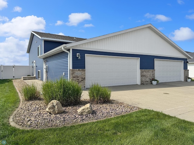 4832 51st Ave S, Fargo, ND 58104 - view of side of property featuring brick siding and driveway