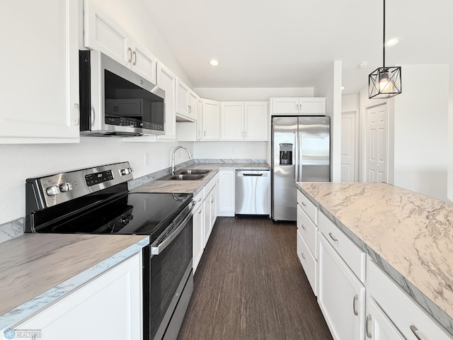 4832 51st Ave S, Fargo, ND 58104 - kitchen with stainless steel appliances, dark wood-style flooring, white cabinets, light stone counters, and recessed lighting