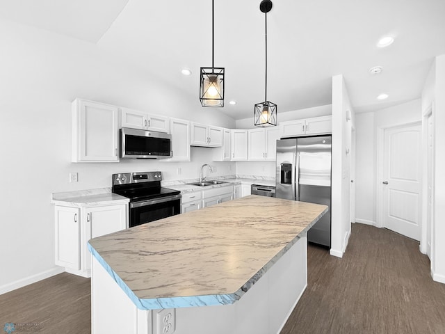 4832 51st Ave S, Fargo, ND 58104 - kitchen featuring appliances with stainless steel finishes, white cabinetry, recessed lighting, dark wood-style floors, and light countertops