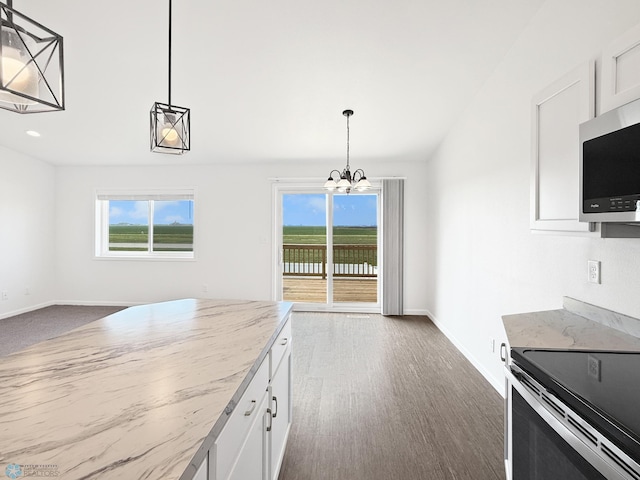 4832 51st Ave S, Fargo, ND 58104 - kitchen featuring appliances with stainless steel finishes, a chandelier, white cabinets, and light stone countertops