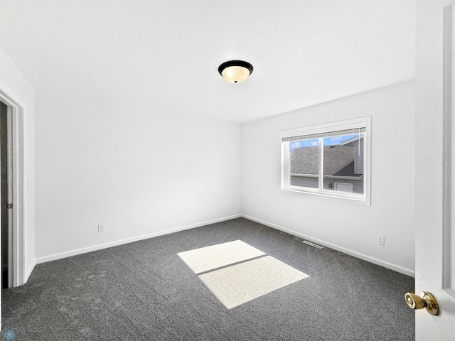 4832 51st Ave S, Fargo, ND 58104 - spare room with dark colored carpet