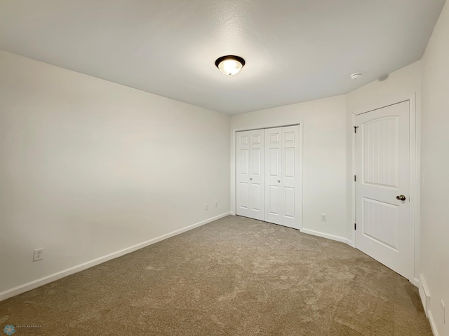 4832 51st Ave S, Fargo, ND 58104 - unfurnished bedroom featuring carpet floors and a closet