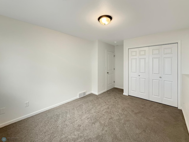 4832 51st Ave S, Fargo, ND 58104 - unfurnished bedroom featuring carpet floors and a closet