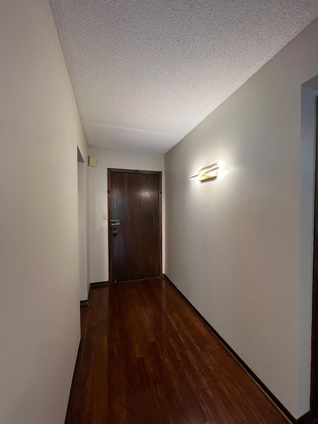 2485 Londin Ln E Unit 418, Maplewood, MN 55119 - hall featuring a textured ceiling and dark wood-type flooring