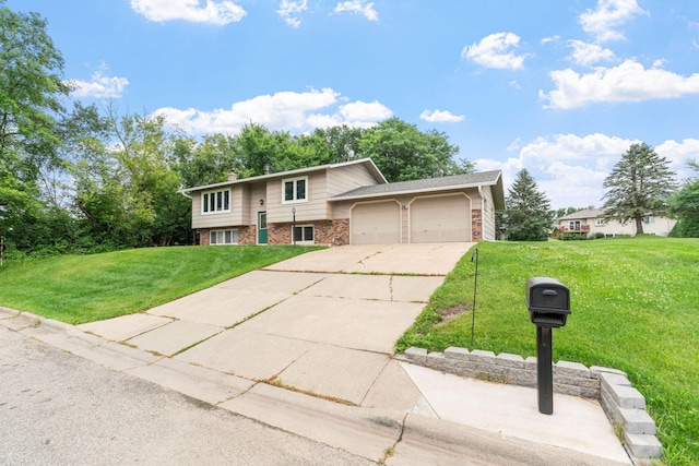 540 4th St E, Wanamingo, MN 55983 - raised ranch with brick siding, a front lawn, a garage, concrete driveway, and a chimney