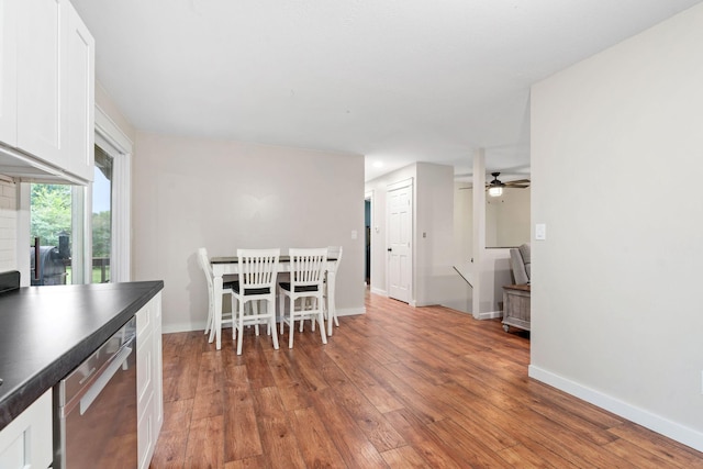 540 4th St E, Wanamingo, MN 55983 - dining space with light wood-type flooring and a ceiling fan