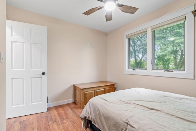 540 4th St E, Wanamingo, MN 55983 - bedroom with light wood-style floors and ceiling fan