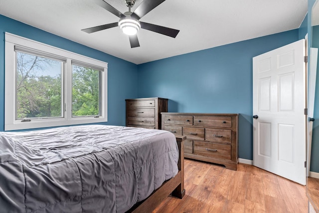 540 4th St E, Wanamingo, MN 55983 - bedroom with light wood finished floors and ceiling fan