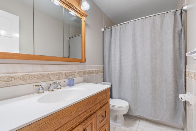 540 4th St E, Wanamingo, MN 55983 - full bath featuring vanity, tile patterned floors, tile walls, curtained shower, and a wainscoted wall