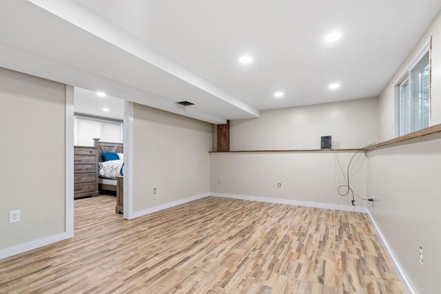 540 4th St E, Wanamingo, MN 55983 - below grade area with light wood-style floors and recessed lighting