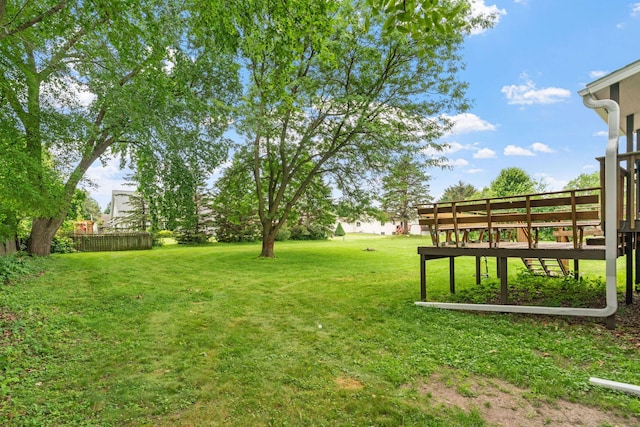 540 4th St E, Wanamingo, MN 55983 - view of green lawn with a wooden deck