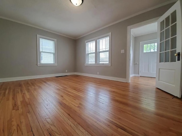 1138 7th Ave SE, Rochester, MN 55904 - spare room with hardwood / wood-style flooring and ornamental molding
