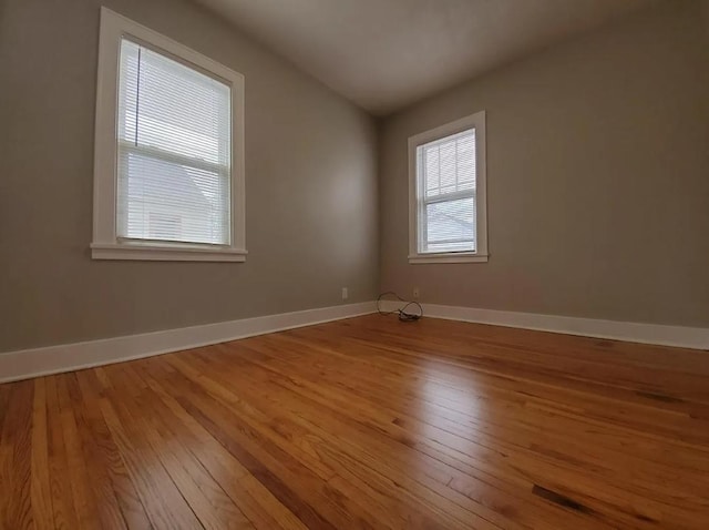 1138 7th Ave SE, Rochester, MN 55904 - spare room with wood-type flooring