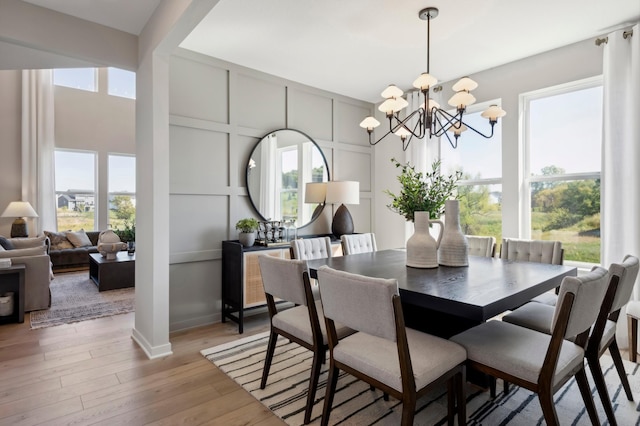 14540 106th Pl N, Maple Grove, MN 55369 - dining area featuring a chandelier and light wood-type flooring