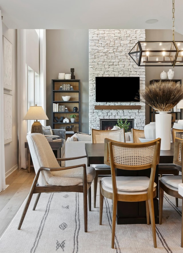 14540 106th Pl N, Maple Grove, MN 55369 - dining room featuring a chandelier and a fireplace