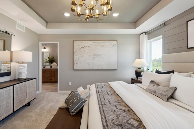 14540 106th Pl N, Maple Grove, MN 55369 - bedroom with a chandelier, a raised ceiling, light carpet, connected bathroom, and recessed lighting