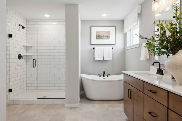14540 106th Pl N, Maple Grove, MN 55369 - full bath featuring a shower stall, vanity, a freestanding tub, and tile patterned floors