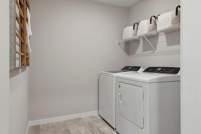 14540 106th Pl N, Maple Grove, MN 55369 - laundry area with separate washer and dryer and baseboards
