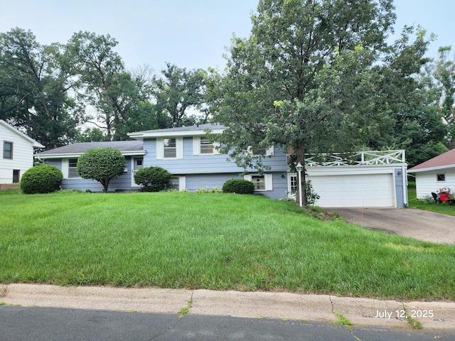 5043 Overlook Cir, Bloomington, MN 55437 - tri-level home featuring concrete driveway, a front yard, and a garage