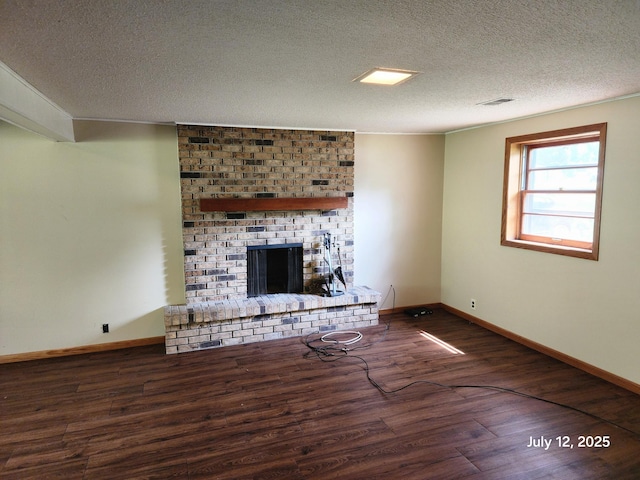 5043 Overlook Cir, Bloomington, MN 55437 - unfurnished living room featuring wood finished floors, a brick fireplace, and a textured ceiling