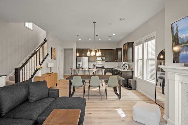 8120 Arrowwood Ln N, Maple Grove, MN 55369 - living area with light wood-style floors, stairs, and recessed lighting
