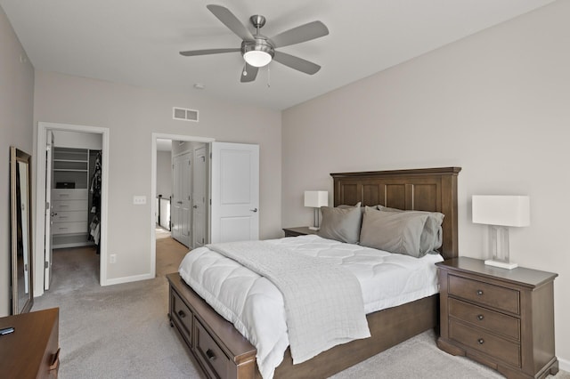 8120 Arrowwood Ln N, Maple Grove, MN 55369 - bedroom with a spacious closet, light carpet, and a ceiling fan